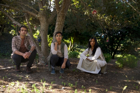 Rajna Swaminathan, ganavya doraiswamy & Utsav Lal in front of a tree